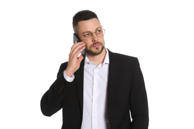 Businessman in glasses talking on smartphone against white background