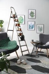 Stylish living room interior with decorative ladder