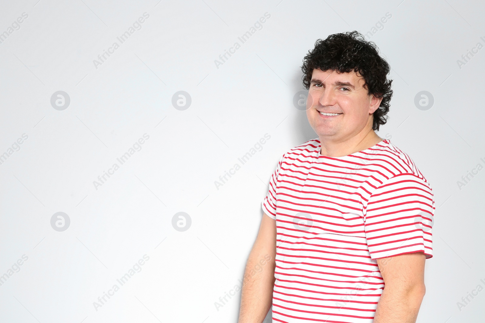 Photo of Portrait of handsome mature man posing on white background