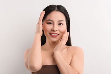 Portrait of beautiful woman on white background