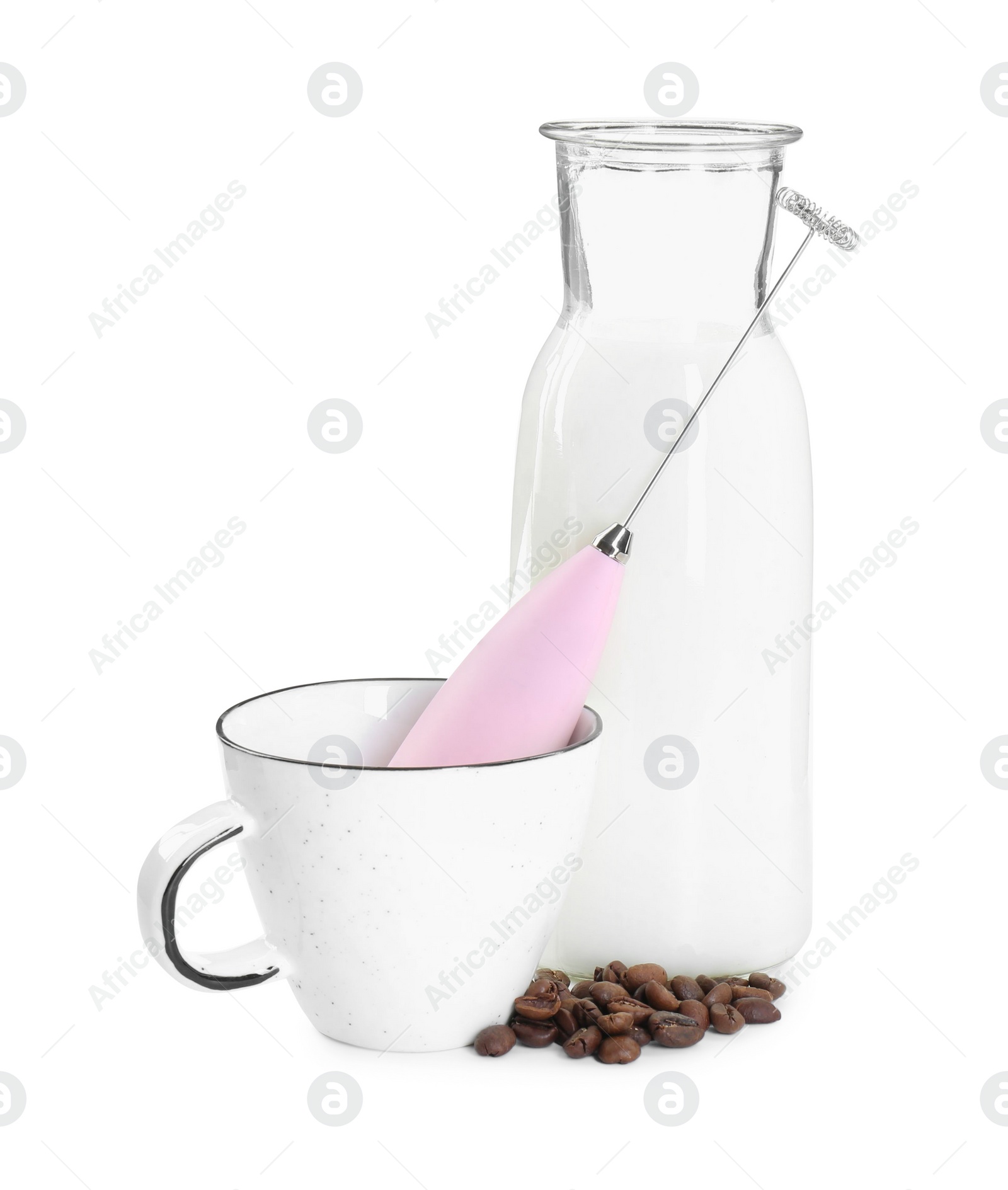 Photo of Pink mini mixer (milk frother), cup, coffee beans and bottle isolated on white