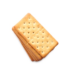 Stack of delicious crispy crackers isolated on white, top view