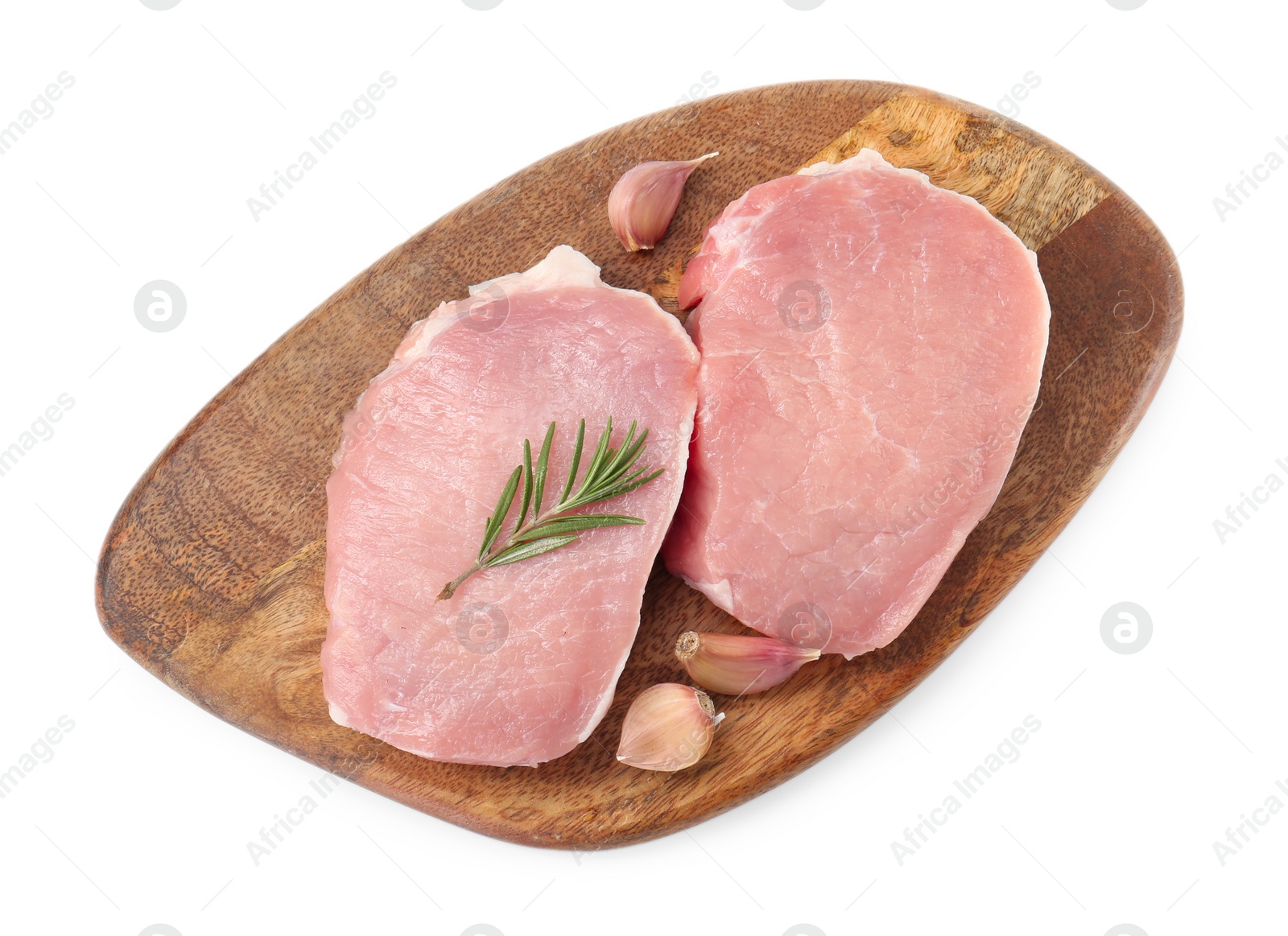 Photo of Wooden board with pieces of raw pork meat, rosemary and garlic isolated on white, top view