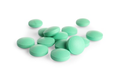 Photo of Many light green pills isolated on white