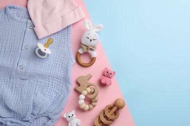 Flat lay composition with baby clothes and accessories on color background, space for text