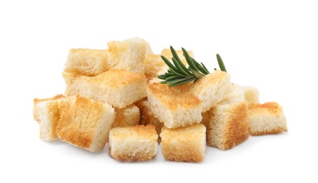Photo of Delicious crispy croutons with rosemary on white background