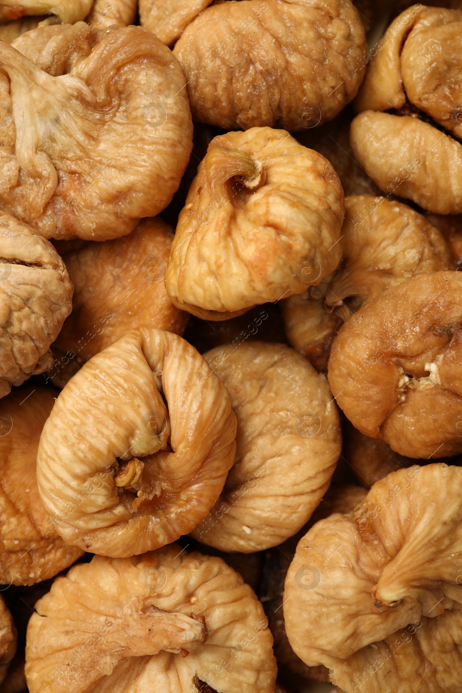 Photo of Many tasty dried figs as background, top view