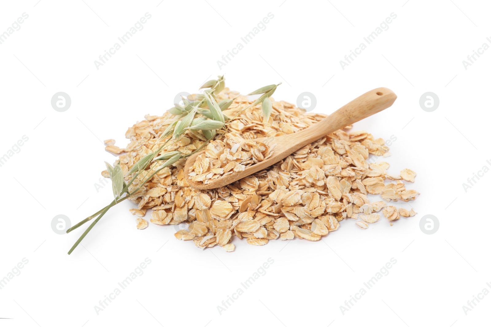 Photo of Wooden spoon with oatmeal and florets isolated on white