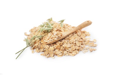 Photo of Wooden spoon with oatmeal and florets isolated on white