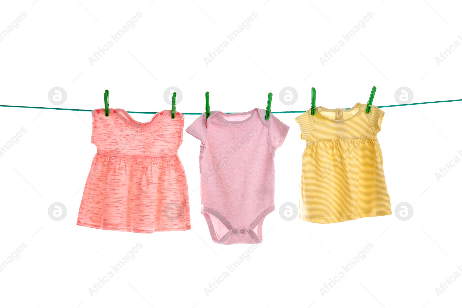 Photo of Baby clothes on laundry line against white background