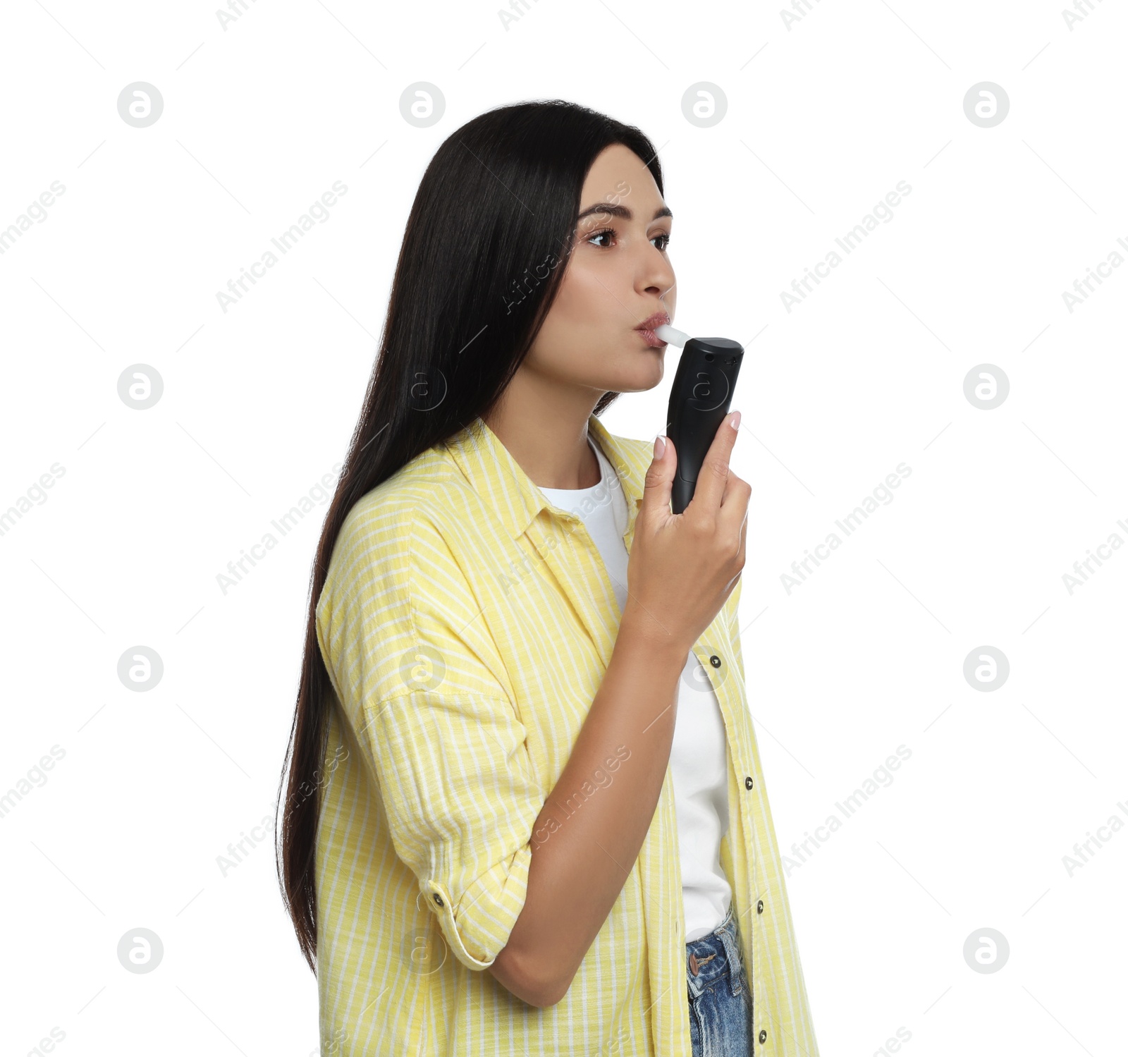 Photo of Woman blowing into breathalyzer on white background