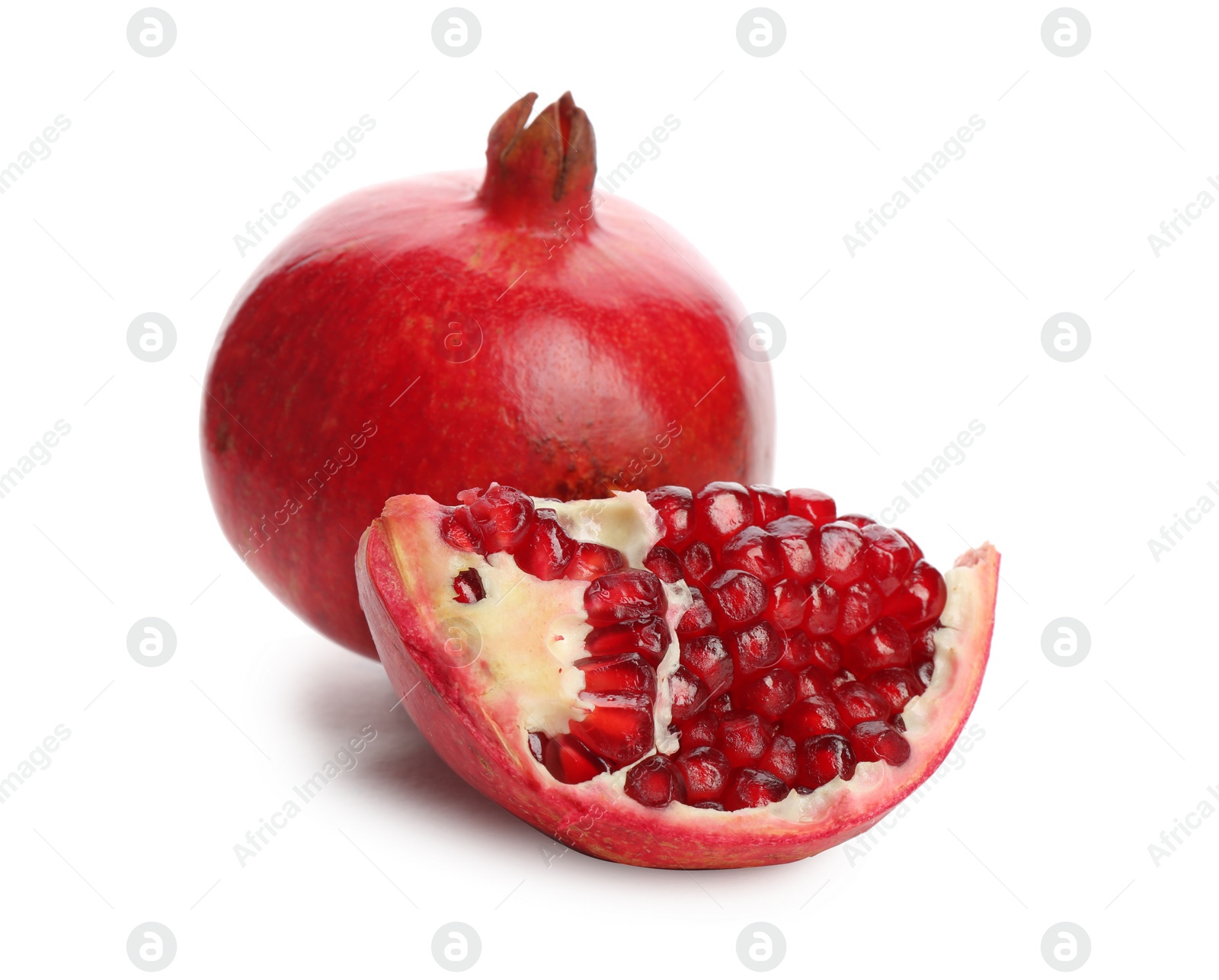 Photo of Ripe pomegranates on white background. Delicious fruits