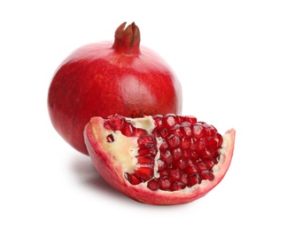 Photo of Ripe pomegranates on white background. Delicious fruits