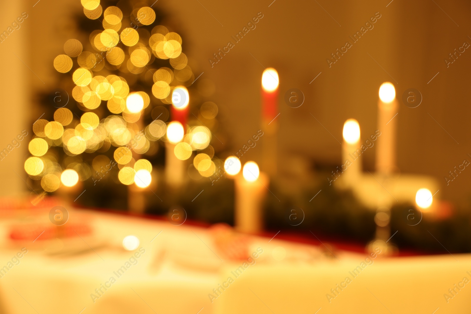 Photo of Blurred view of festive table setting and beautiful Christmas decor indoors. Interior design