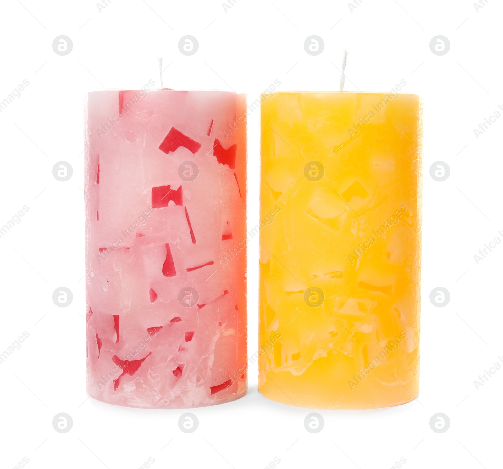 Photo of Two color wax candles on white background