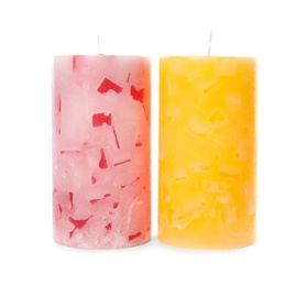 Two color wax candles on white background
