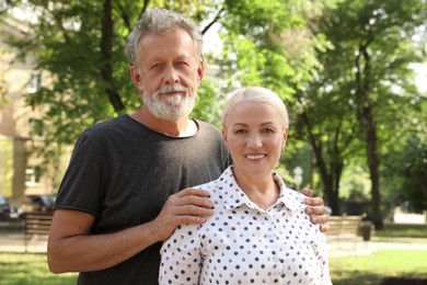 Photo of Portrait of lovely mature couple in park