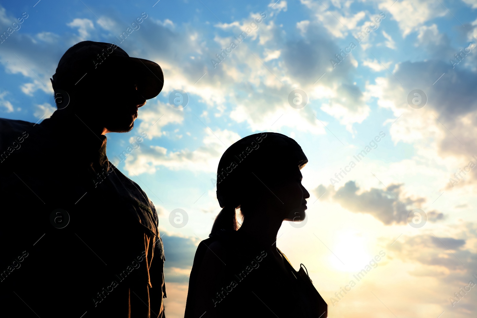 Photo of Soldiers in uniform patrolling outdoors. Military service