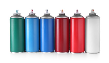 Many spray paint cans isolated on white