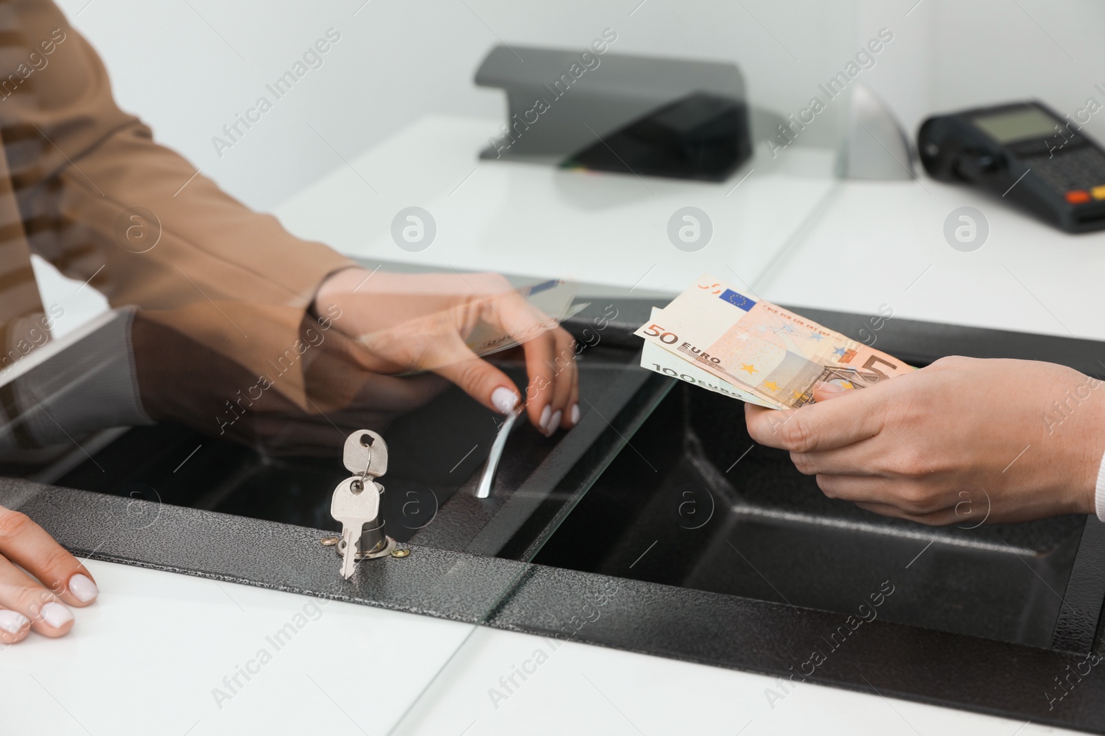 Photo of Man giving money to cashier in bank, closeup. Currency exchange