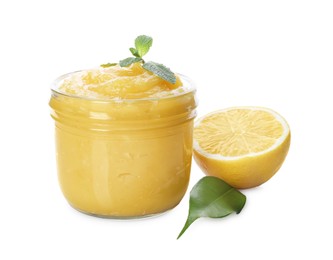 Photo of Delicious lemon curd in glass jar, fresh citrus fruit, mint and green leaf isolated on white