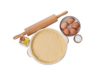 Pie tin with fresh dough, rolling pin and ingredients isolated on white, top view. Making quiche