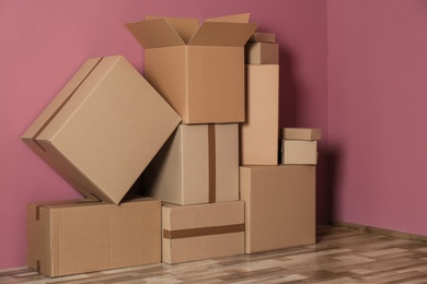 Photo of Cardboard boxes on floor indoors