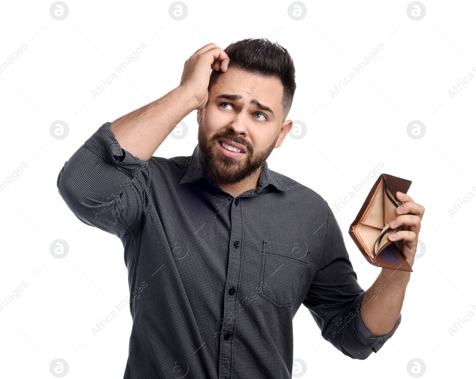 Photo of Upset man showing empty wallet on white background