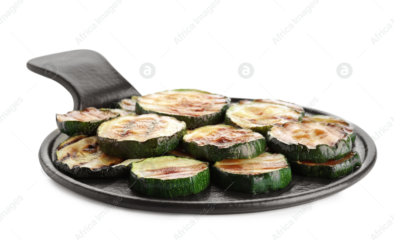 Photo of Slate plate of delicious grilled zucchini slices on white background