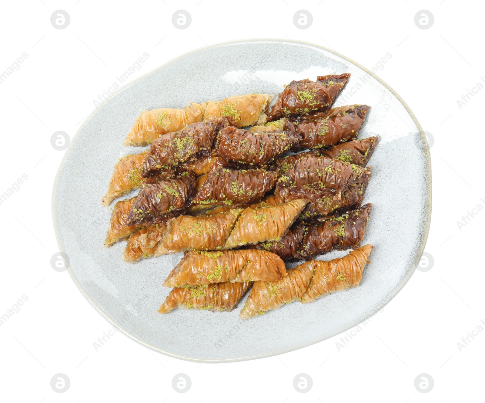 Photo of Plate of delicious baklava with pistachio nuts on white background, top view