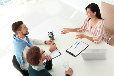 Human resources manager conducting job interview with applicants in office