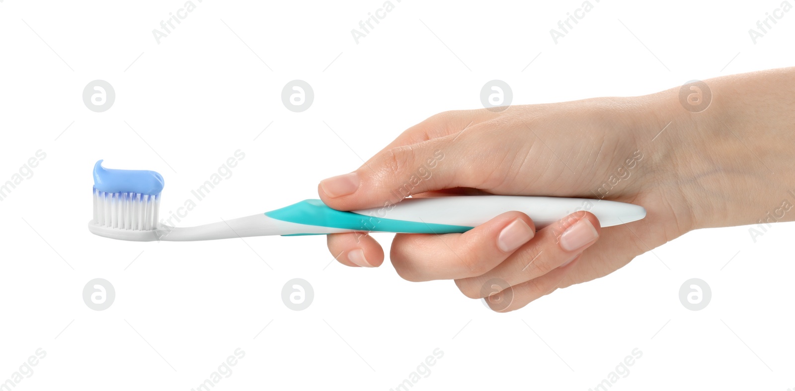 Photo of Woman holding toothbrush with paste on white background, closeup