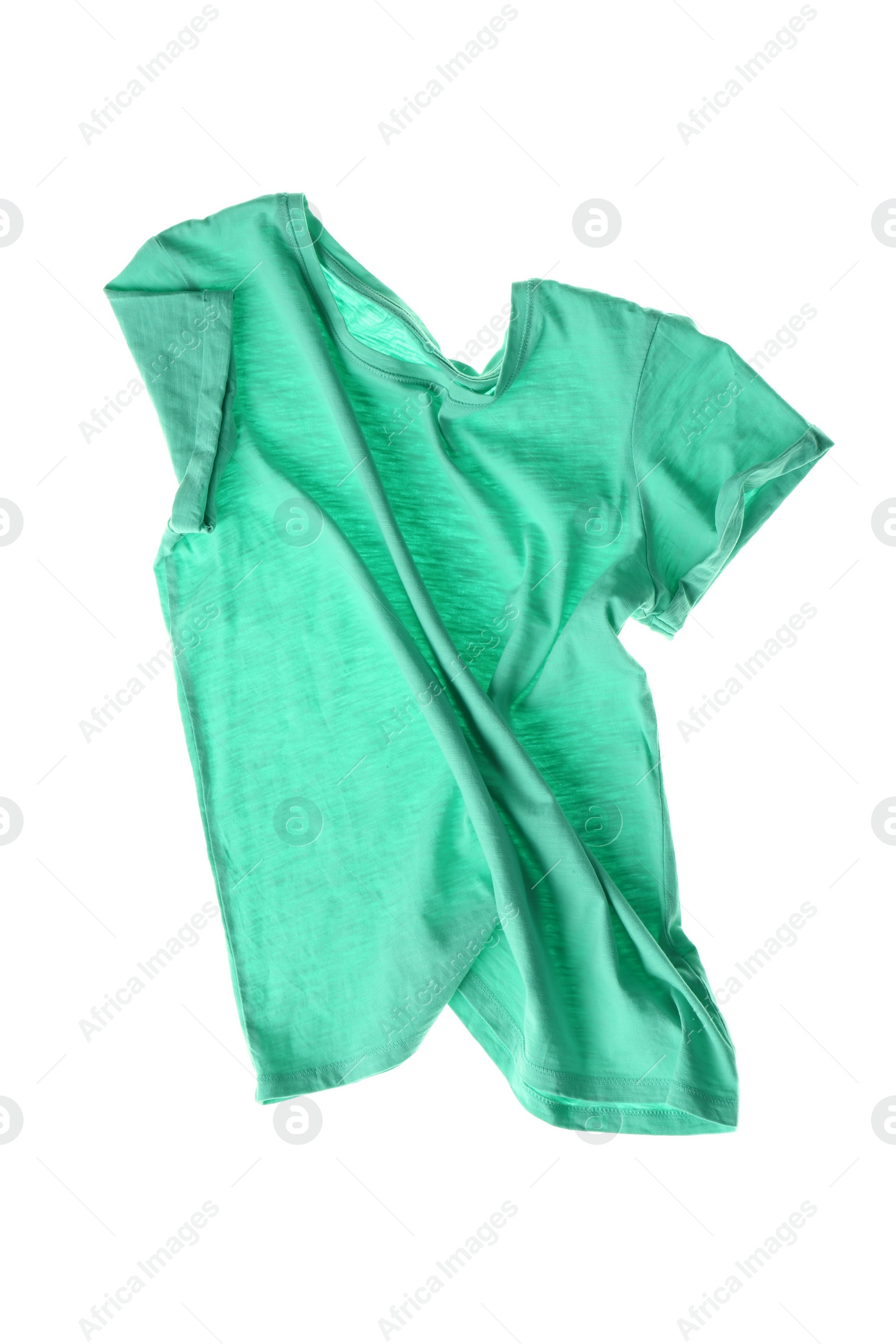 Photo of Rumpled turquoise t-shirt isolated on white. Messy clothes