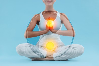 Image of Woman meditating on light blue background, closeup. Yin and yang symbol