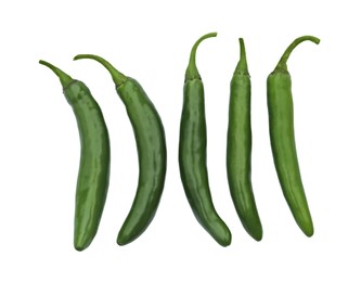 Photo of Green hot chili peppers on white background, top view