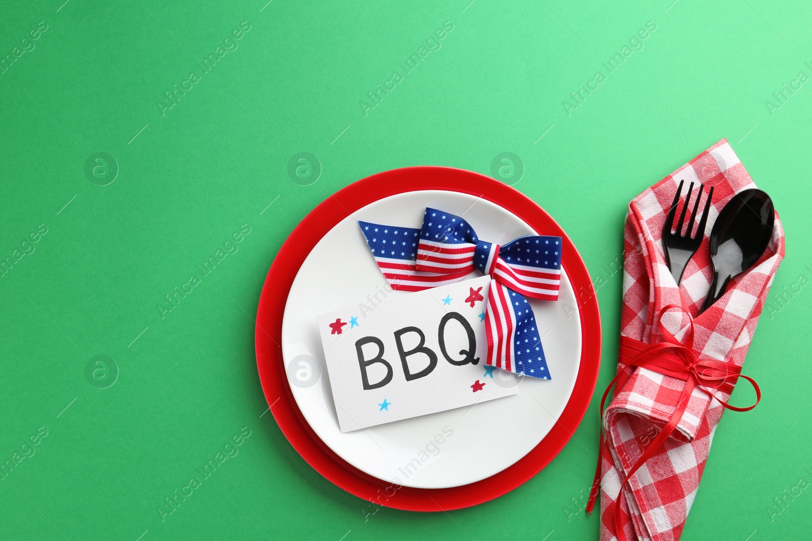 Photo of Set of dishware on color background, top view. USA Independence Day