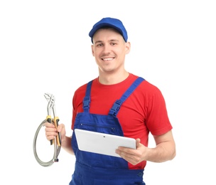 Young plumber with tablet computer on white background