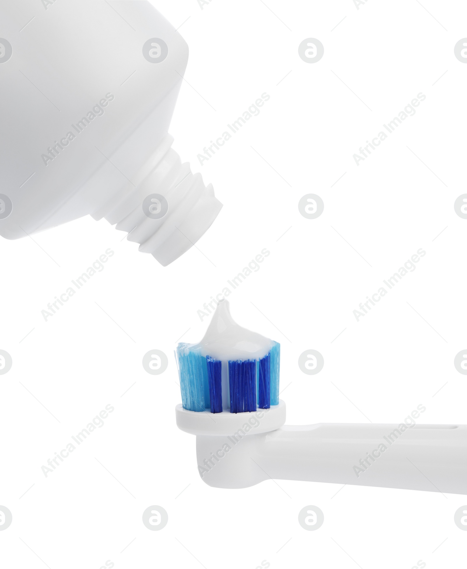 Photo of Electric toothbrush with paste on white background, closeup