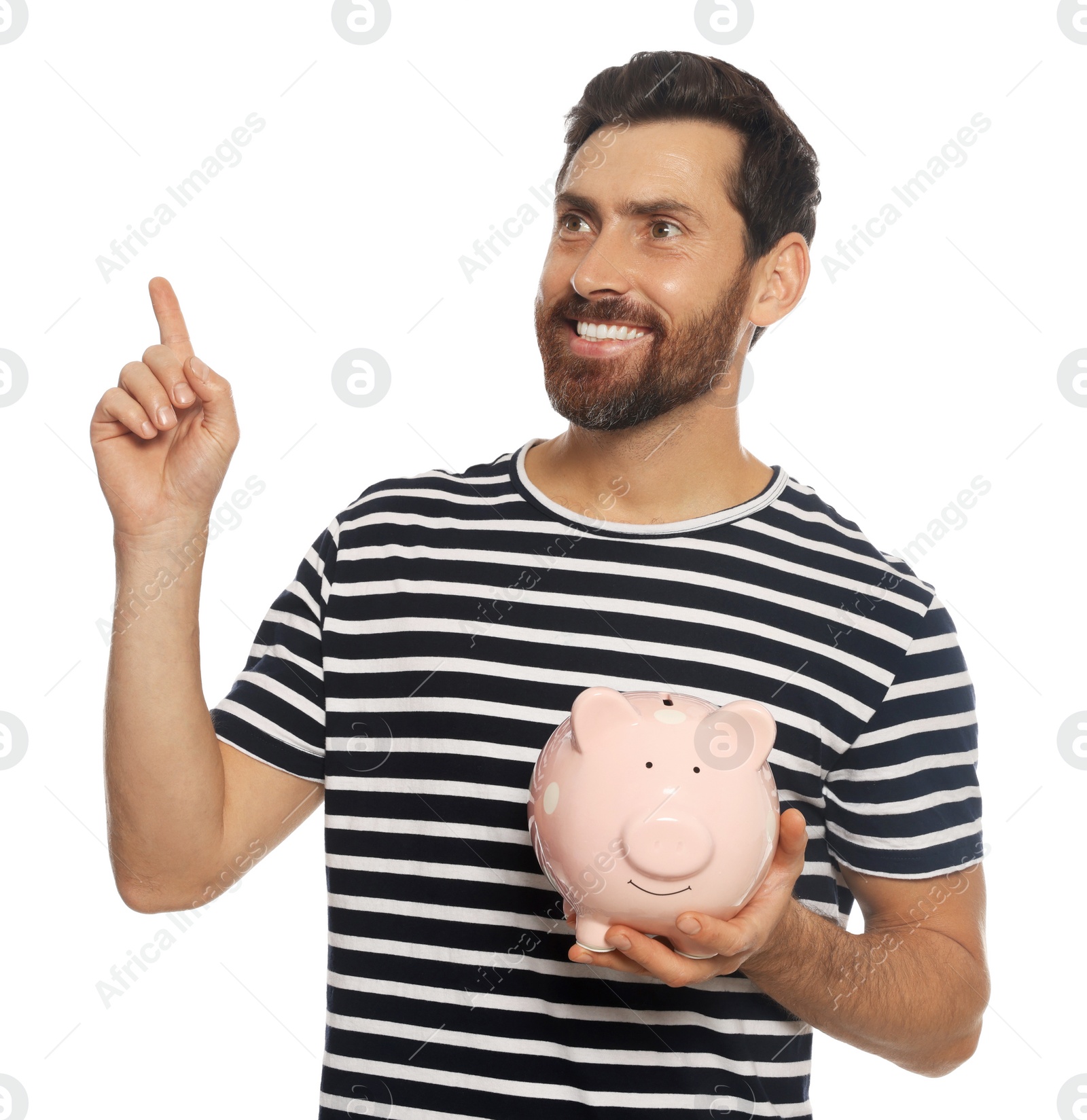 Photo of Happy man with ceramic piggy bank on white background