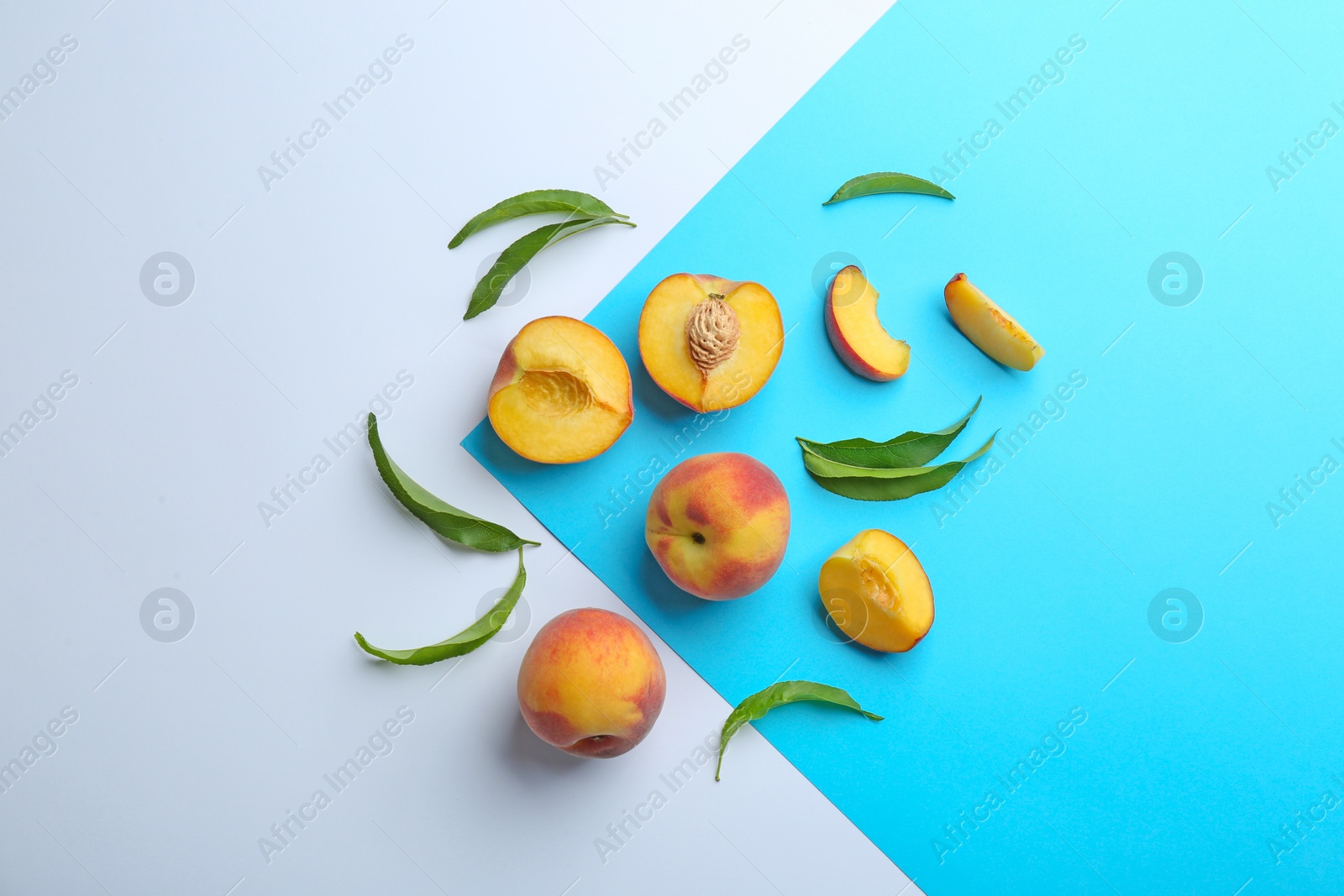 Photo of Flat lay composition with fresh peaches on color background