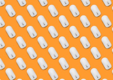 Image of Many white computer mouses on orange background, flat lay. Seamless pattern design