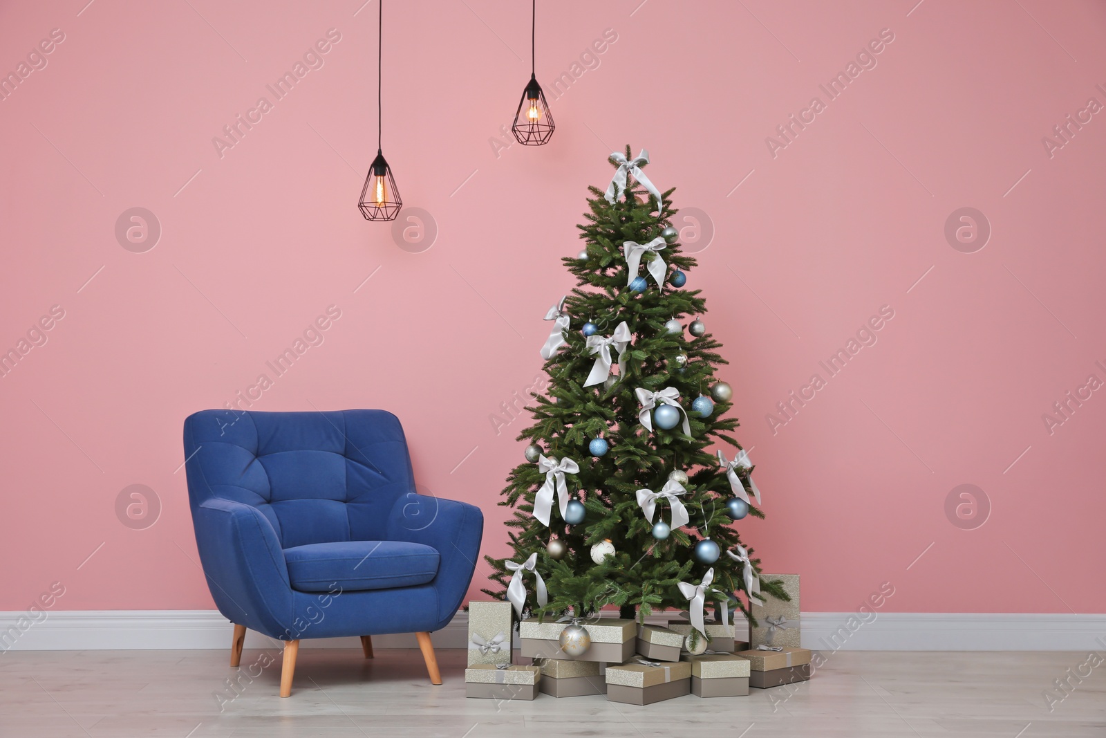 Photo of Stylish room interior with decorated Christmas tree