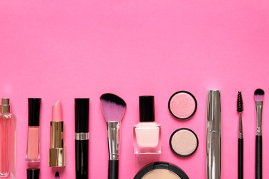 Photo of Flat lay composition with products for decorative makeup on pink background