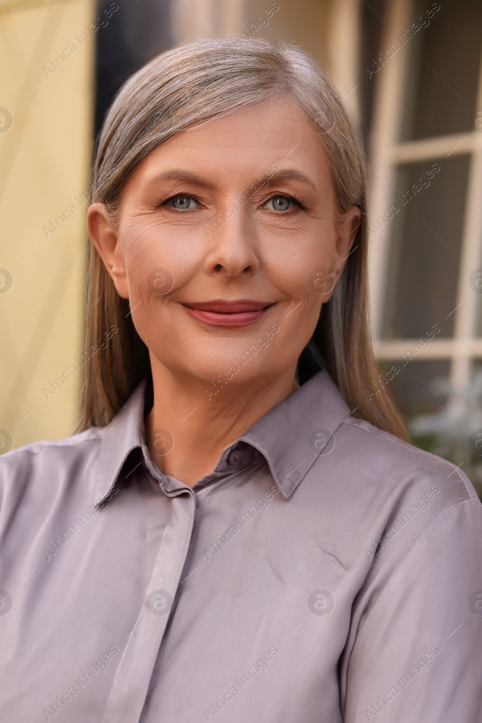 Photo of Portrait of beautiful smiling senior woman outdoors