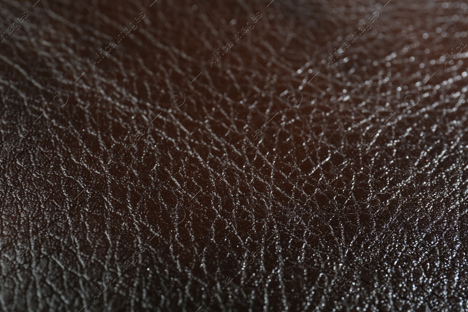 Photo of Texture of brown leather as background, closeup