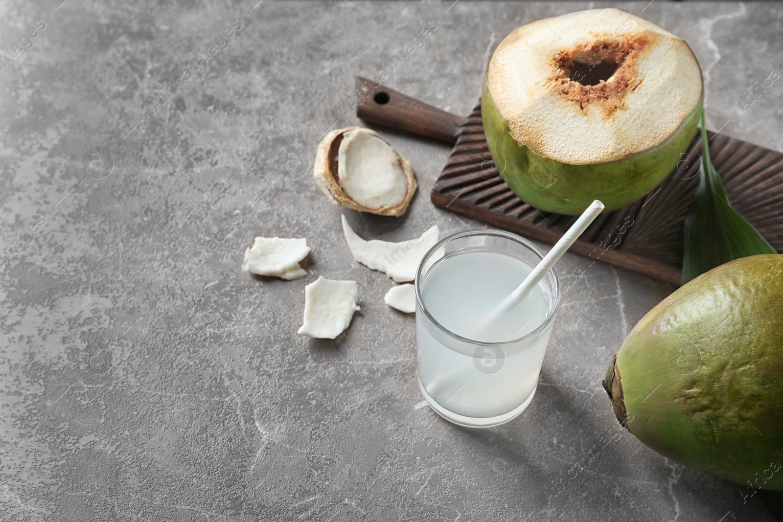 Photo of Beautiful composition with glass of coconut water on table