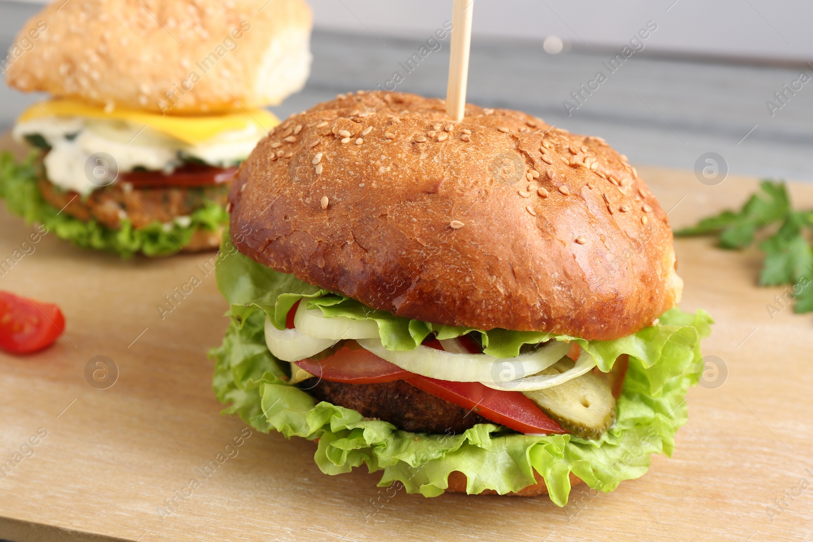 Photo of Delicious vegetarian burgers served on table, closeup