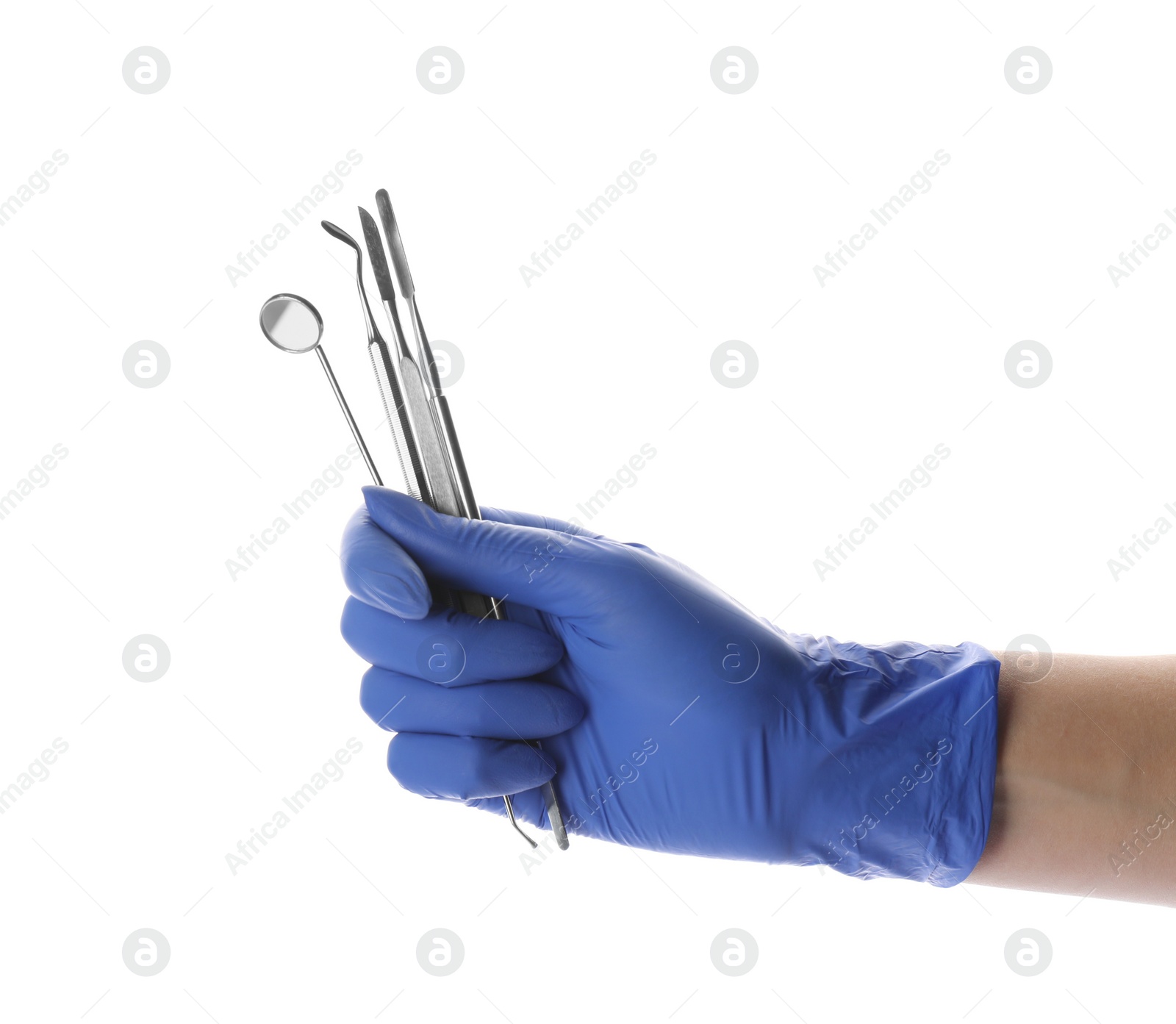Photo of Dentist holding set of tools on white background, closeup