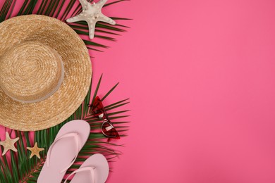 Photo of Flat lay composition with beach objects on pink background, space for text