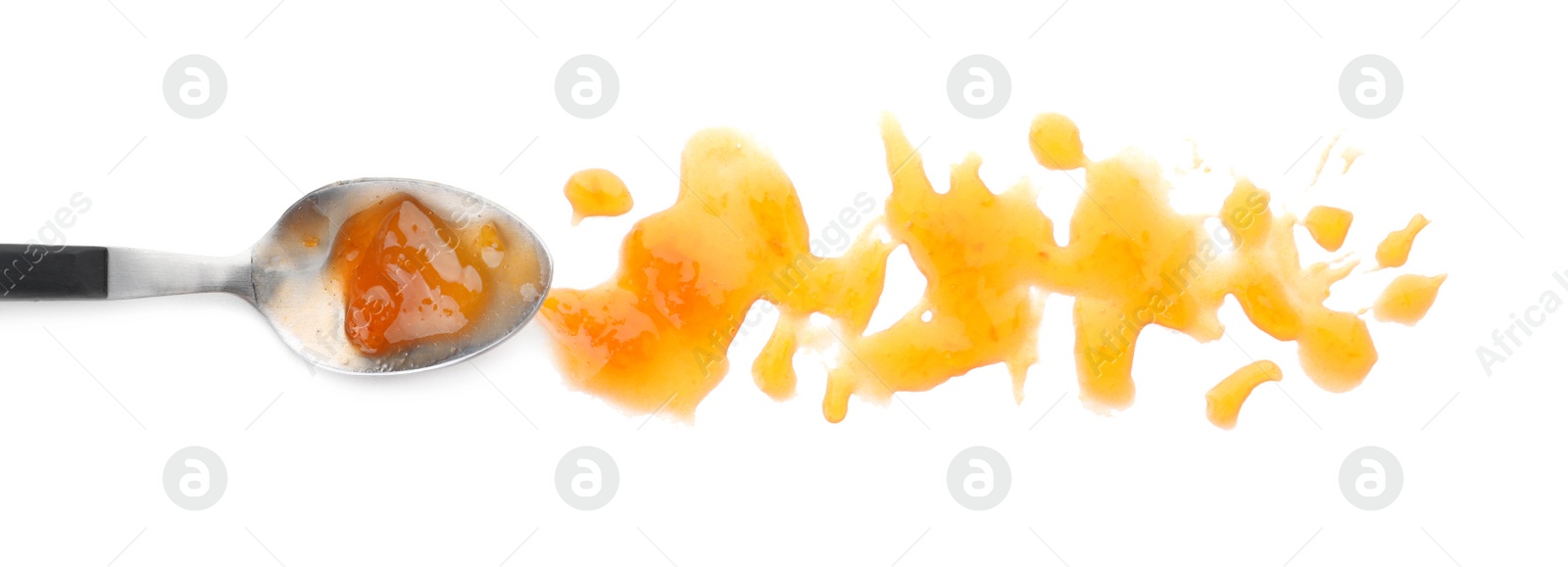 Photo of Spoon and sweet jam on white background